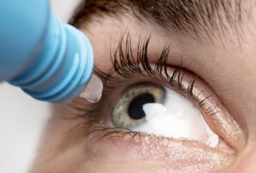 man-using-eye-drops-close-up